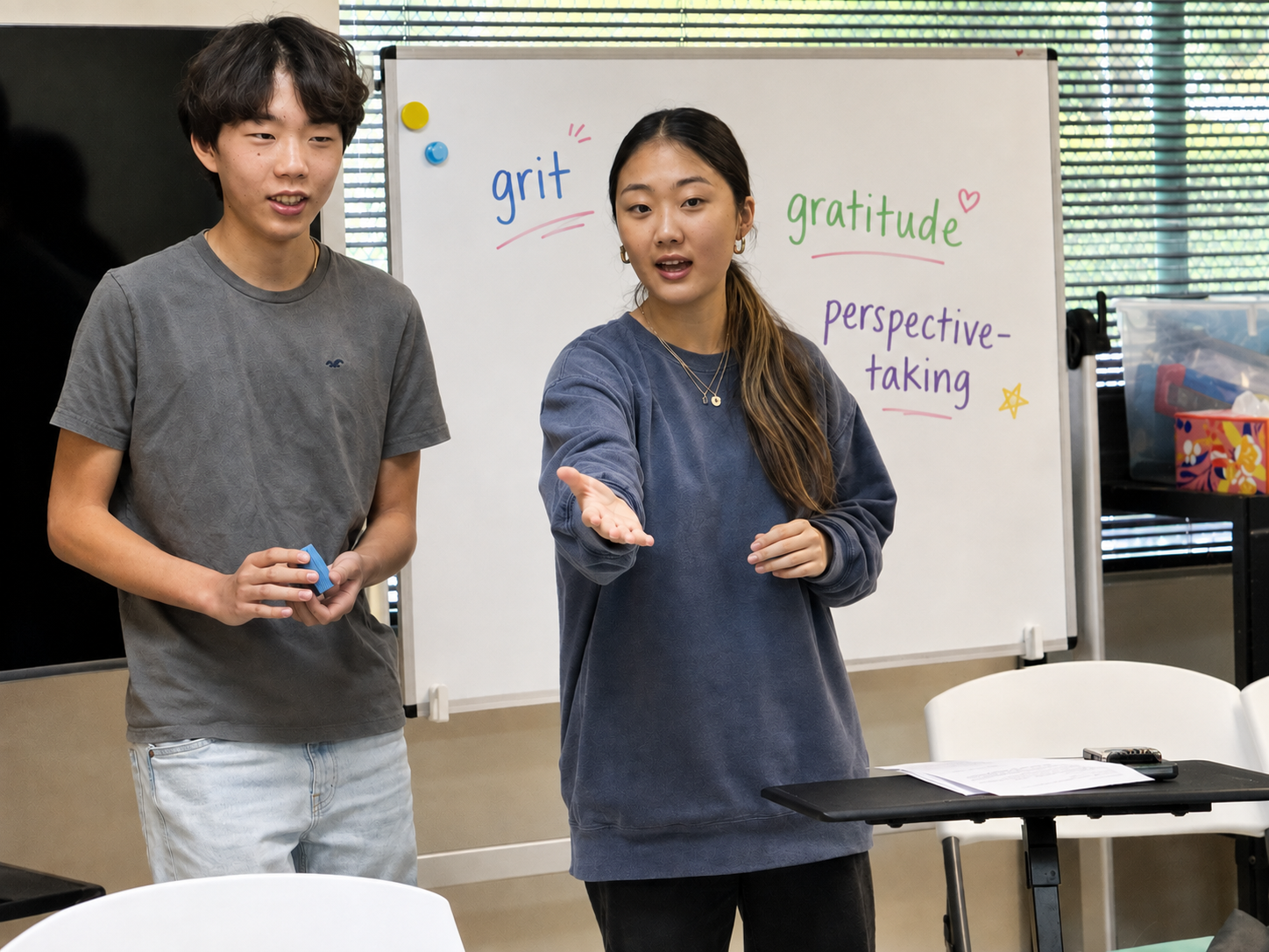 The two student founders leading an eq2 workshop